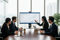 Business team in a modern office having an SEO strategy session with analytics graphs on screen